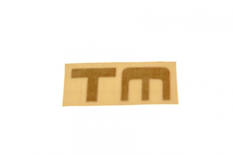 Frametransfer goud/zwart "TM" Niet op een transparante folie maar mooie gouden letters met zwarte rand!
